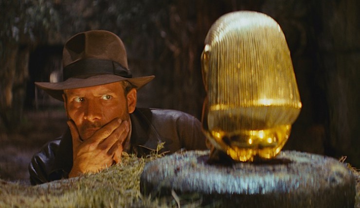 Archeologist Indiana Jones eyes a golden idol in the remastered Imax version of "Raiders of the Lost Ark" being released September 7, 2012 in selected theaters. (Lucasfilm/MCT)